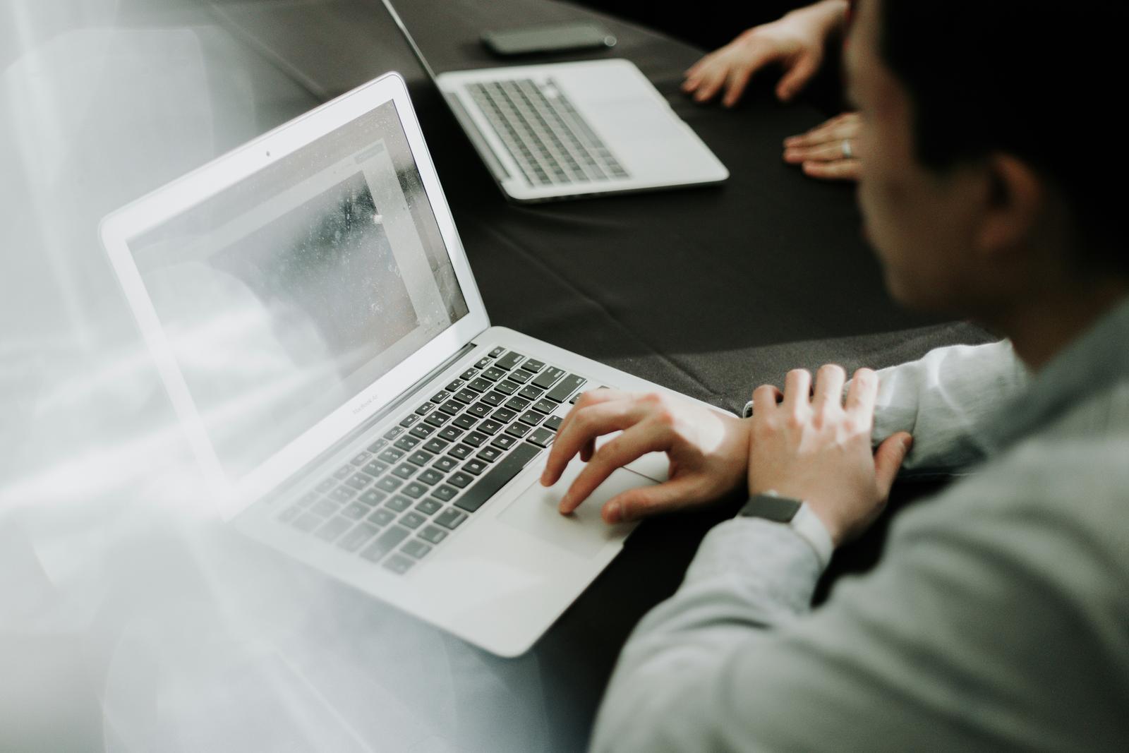 IT support engineer working on a laptop